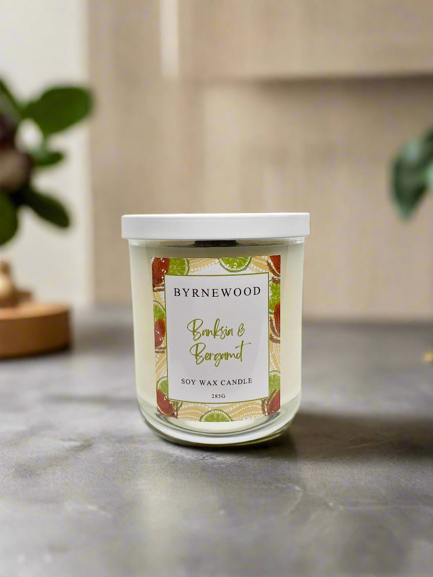 Byrnewood Banksia & Bergamot handcrafted scented soy wax candle with a wood wick, poured into a large 285g luxury glass vessel – made on the Gold Coast, Australia for an eco-friendly, clean-burning, and beautifully fragranced experience.