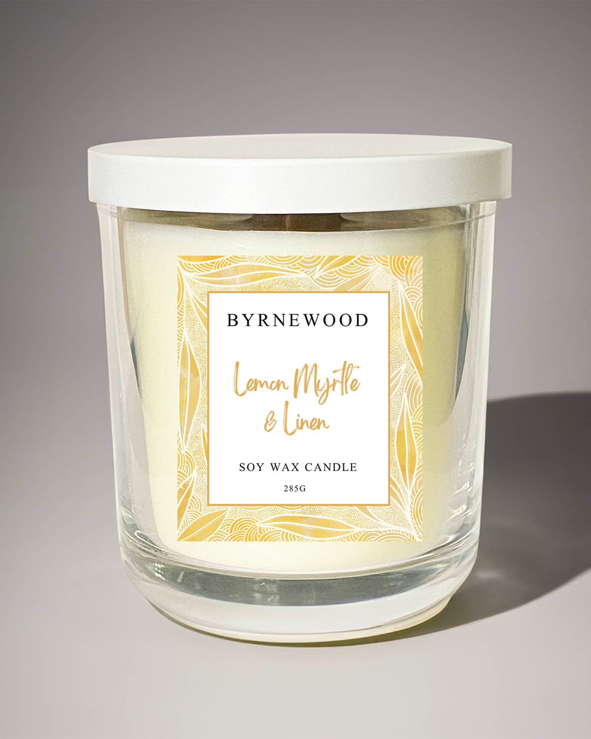 Byrnewood Yellow Lemon Myrtle & Linen handcrafted scented soy wax candle with a wood wick, poured into a large 285g luxury glass vessel – made on the Gold Coast, Australia for an eco-friendly, clean-burning, and beautifully fragranced experience.